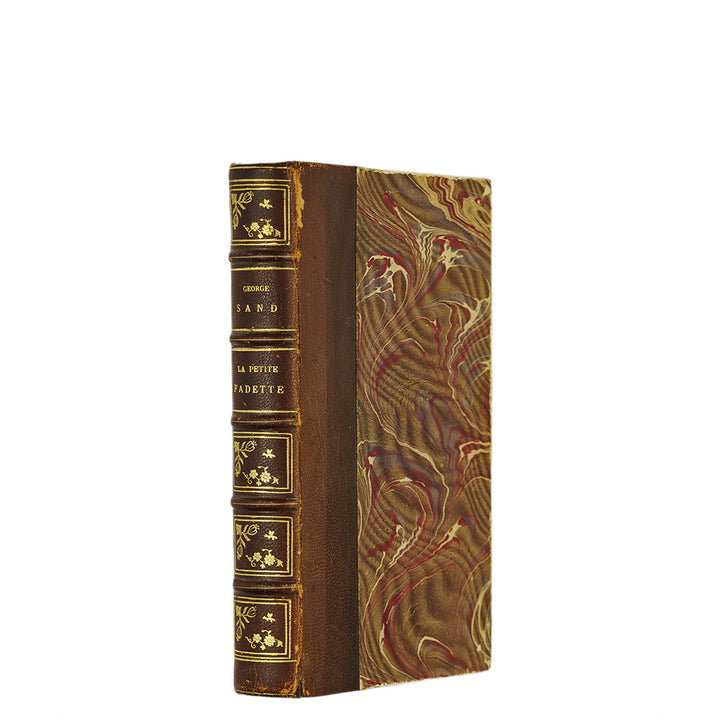 George Sand — La Petite Fadette (Calmann-Lévy, c. 1900). Século XIX. Encadernação em meio couro com douração. Livro físico.