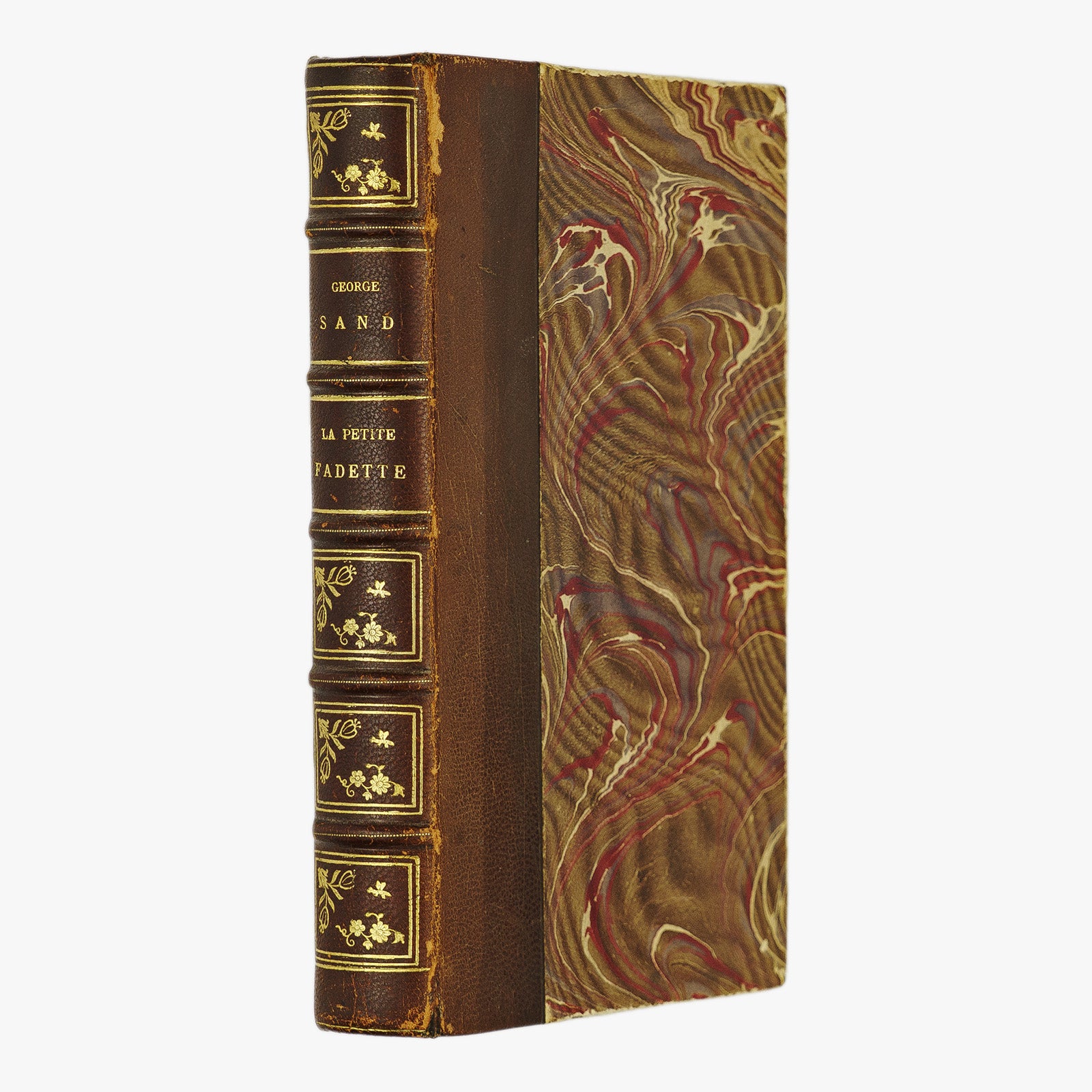 George Sand — La Petite Fadette (Calmann-Lévy, c. 1900). Século XIX. Encadernação em meio couro com douração. Livro físico.