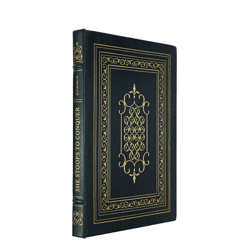 Oliver Goldsmith — She Stoops to Conquer (The Easton Press, 1978). Livro físico ilustrado. Encadernação de luxo - capa de couro, cortes dourados e fita de leitura em cetim.