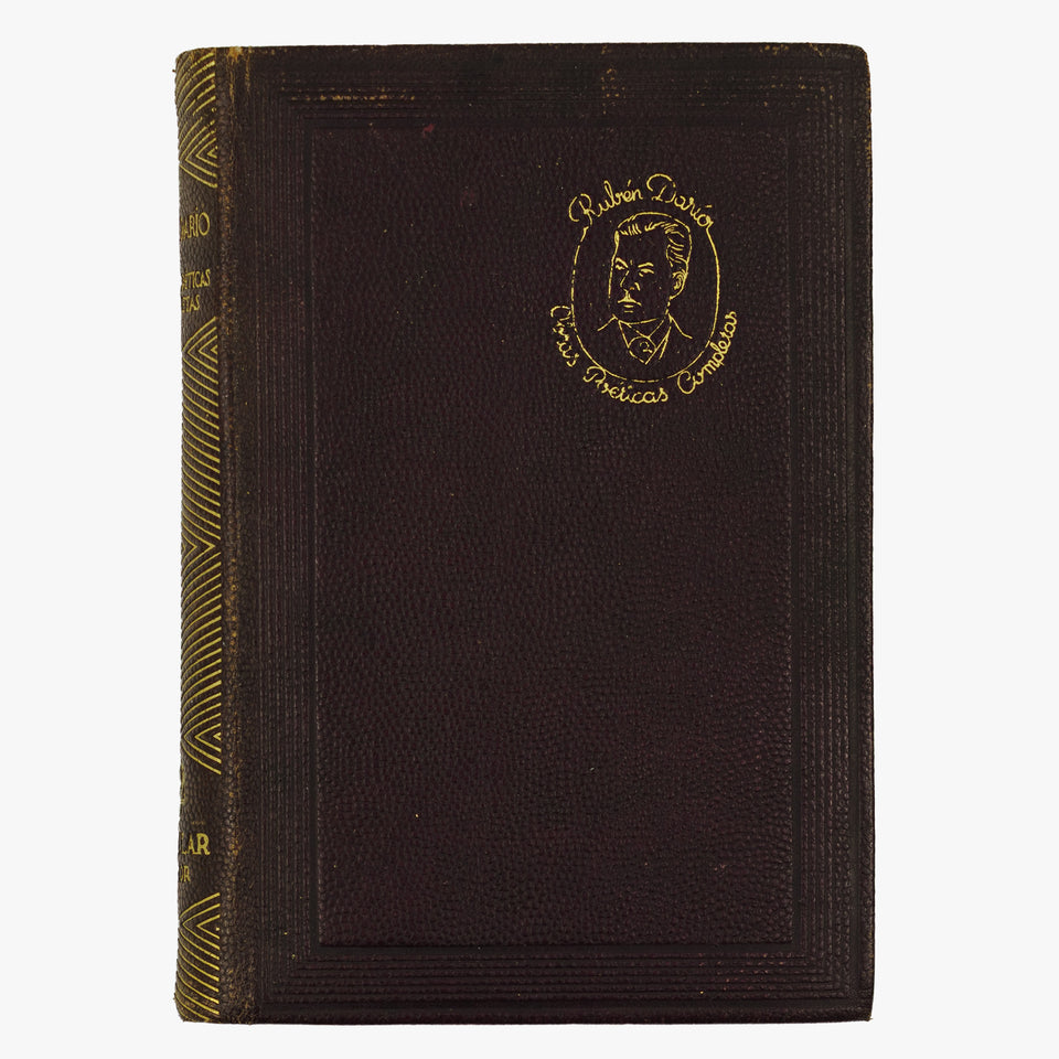 Rubén Darío — Obras poéticas completas (M. Aguilar - Editor, 1945). Encadernação em couro com douração. Cortes tingidos com ornamentos.